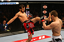 MONTREAL, QC - MARCH 16: Quinn Mulhern throws a front kick against Rick Story in their welterweight bout during the UFC 158 event at Bell Centre on March 16, 2013 in Montreal, Quebec, Canada.  (Photo by Jonathan Ferrey/Zuffa LLC/Zuffa LLC via Getty Images)