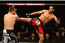 MONTREAL, QC - MARCH 16: (R-L) Quinn Mulhern lands a kick against Quinn Mulhern in their welterweight bout during the UFC 158 event at Bell Centre on March 16, 2013 in Montreal, Quebec, Canada.  (Photo by Jonathan Ferrey/Zuffa LLC/Zuffa LLC via Getty Images)