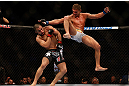 MONTREAL, QC - MARCH 16: Daron Cruickshank misses a flying knee against John Makdessi in their lightweight bout during the UFC 158 event at Bell Centre on March 16, 2013 in Montreal, Quebec, Canada.  (Photo by Jonathan Ferrey/Zuffa LLC/Zuffa LLC via Getty Images)