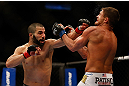 MONTREAL, QC - MARCH 16: John Makdessi punches Daron Cruickshank in their lightweight bout during the UFC 158 event at Bell Centre on March 16, 2013 in Montreal, Quebec, Canada.  (Photo by Jonathan Ferrey/Zuffa LLC/Zuffa LLC via Getty Images)