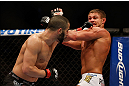 MONTREAL, QC - MARCH 16: John Makdessi punches Daron Cruickshank in their lightweight bout during the UFC 158 event at Bell Centre on March 16, 2013 in Montreal, Quebec, Canada.  (Photo by Jonathan Ferrey/Zuffa LLC/Zuffa LLC via Getty Images)