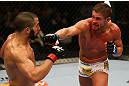 MONTREAL, QC - MARCH 16: Daron Cruickshank lands a punch on John Makdessi in their lightweight bout during the UFC 158 event at Bell Centre on March 16, 2013 in Montreal, Quebec, Canada.  (Photo by Jonathan Ferrey/Zuffa LLC/Zuffa LLC via Getty Images)