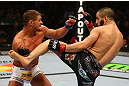 MONTREAL, QC - MARCH 16: John Makdessi lands a kick against Daron Cruickshank in their lightweight bout during the UFC 158 event at Bell Centre on March 16, 2013 in Montreal, Quebec, Canada.  (Photo by Jonathan Ferrey/Zuffa LLC/Zuffa LLC via Getty Images)