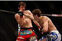 MONTREAL, QC - MARCH 16: Jordan Mein punches Dan Miller in their welterweight bout during the UFC 158 event at Bell Centre on March 16, 2013 in Montreal, Quebec, Canada.  (Photo by Josh Hedges/Zuffa LLC/Zuffa LLC via Getty Images)
