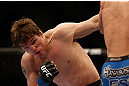 MONTREAL, QC - MARCH 16:  Darren Elkins punches Antonio Carvalhoin their featherweight bout during the UFC 158 event at Bell Centre on March 16, 2013 in Montreal, Quebec, Canada.  (Photo by Jonathan Ferrey/Zuffa LLC/Zuffa LLC via Getty Images)