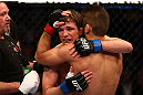 MONTREAL, QC - MARCH 16:  Darren Elkins hugs Antonio Carvalho after their featherweight bout during the UFC 158 event at Bell Centre on March 16, 2013 in Montreal, Quebec, Canada.  (Photo by Jonathan Ferrey/Zuffa LLC/Zuffa LLC via Getty Images)