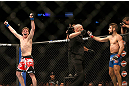 MONTREAL, QC - MARCH 16: Darren Elkins raises his hands in victory over Antonio Carvalho in their featherweight bout during the UFC 158 event at Bell Centre on March 16, 2013 in Montreal, Quebec, Canada.  (Photo by Jonathan Ferrey/Zuffa LLC/Zuffa LLC via Getty Images)