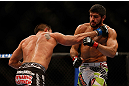 MONTREAL, QC - MARCH 16: (R-L) Patrick Cote fights against Bobby Voelker in their welterweight bout during the UFC 158 event at Bell Centre on March 16, 2013 in Montreal, Quebec, Canada.  (Photo by Jonathan Ferrey/Zuffa LLC/Zuffa LLC via Getty Images)