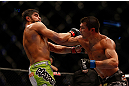 MONTREAL, QC - MARCH 16: (R-L) Patrick Cote fights against Bobby Voelker in their welterweight bout during the UFC 158 event at Bell Centre on March 16, 2013 in Montreal, Quebec, Canada.  (Photo by Jonathan Ferrey/Zuffa LLC/Zuffa LLC via Getty Images)