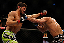 MONTREAL, QC - MARCH 16: (R-L) Patrick Cote lands a punch on Bobby Voelker in their welterweight bout during the UFC 158 event at Bell Centre on March 16, 2013 in Montreal, Quebec, Canada.  (Photo by Jonathan Ferrey/Zuffa LLC/Zuffa LLC via Getty Images)