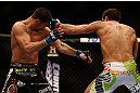 MONTREAL, QC - MARCH 16: (R-L) Patrick Cote lands a punch on Bobby Voelker in their welterweight bout during the UFC 158 event at Bell Centre on March 16, 2013 in Montreal, Quebec, Canada.  (Photo by Jonathan Ferrey/Zuffa LLC/Zuffa LLC via Getty Images)