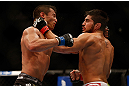 MONTREAL, QC - MARCH 16: (R-L) Patrick Cote lands a punch on Bobby Voelker in their welterweight bout during the UFC 158 event at Bell Centre on March 16, 2013 in Montreal, Quebec, Canada.  (Photo by Jonathan Ferrey/Zuffa LLC/Zuffa LLC via Getty Images)