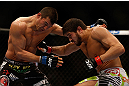 MONTREAL, QC - MARCH 16: (R-L) Patrick Cote lands a punch on Bobby Voelker in their welterweight bout during the UFC 158 event at Bell Centre on March 16, 2013 in Montreal, Quebec, Canada.  (Photo by Jonathan Ferrey/Zuffa LLC/Zuffa LLC via Getty Images)