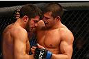 MONTREAL, QC - MARCH 16:  Bobby Voelker embraces Patrick Cote after their welterweight bout during the UFC 158 event at Bell Centre on March 16, 2013 in Montreal, Quebec, Canada.  (Photo by Jonathan Ferrey/Zuffa LLC/Zuffa LLC via Getty Images)