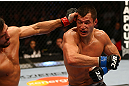 MONTREAL, QC - MARCH 16:  Bobby Voelker punches Patrick Cote in their welterweight bout during the UFC 158 event at Bell Centre on March 16, 2013 in Montreal, Quebec, Canada.  (Photo by Jonathan Ferrey/Zuffa LLC/Zuffa LLC via Getty Images)