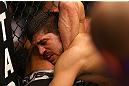 MONTREAL, QC - MARCH 16:  Bobby Voelker tries a choke on Patrick Cote in their welterweight bout during the UFC 158 event at Bell Centre on March 16, 2013 in Montreal, Quebec, Canada.  (Photo by Jonathan Ferrey/Zuffa LLC/Zuffa LLC via Getty Images)