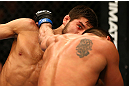 MONTREAL, QC - MARCH 16: (R-L) Patrick Cote lands a punch on Bobby Voelker in their welterweight bout during the UFC 158 event at Bell Centre on March 16, 2013 in Montreal, Quebec, Canada.  (Photo by Jonathan Ferrey/Zuffa LLC/Zuffa LLC via Getty Images)