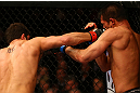 MONTREAL, QC - MARCH 16: (R-L) Patrick Cote lands a punch on Bobby Voelker in their welterweight bout during the UFC 158 event at Bell Centre on March 16, 2013 in Montreal, Quebec, Canada.  (Photo by Jonathan Ferrey/Zuffa LLC/Zuffa LLC via Getty Images)