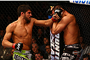 MONTREAL, QC - MARCH 16: (L-R) Patrick Cote lands a punch on Bobby Voelker in their welterweight bout during the UFC 158 event at Bell Centre on March 16, 2013 in Montreal, Quebec, Canada.  (Photo by Jonathan Ferrey/Zuffa LLC/Zuffa LLC via Getty Images)