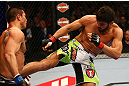 MONTREAL, QC - MARCH 16: (R-L) Patrick Cote lands a kick on Bobby Voelker in their welterweight bout during the UFC 158 event at Bell Centre on March 16, 2013 in Montreal, Quebec, Canada.  (Photo by Jonathan Ferrey/Zuffa LLC/Zuffa LLC via Getty Images)