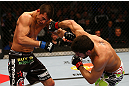 MONTREAL, QC - MARCH 16: (R-L) Patrick Cote lands a punch on Bobby Voelker in their welterweight bout during the UFC 158 event at Bell Centre on March 16, 2013 in Montreal, Quebec, Canada.  (Photo by Jonathan Ferrey/Zuffa LLC/Zuffa LLC via Getty Images)