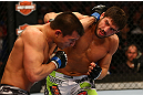 MONTREAL, QC - MARCH 16: (R-L) Patrick Cote lands a punch on Bobby Voelker in their welterweight bout during the UFC 158 event at Bell Centre on March 16, 2013 in Montreal, Quebec, Canada.  (Photo by Jonathan Ferrey/Zuffa LLC/Zuffa LLC via Getty Images)