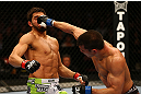 MONTREAL, QC - MARCH 16:  Bobby Voelker punches Patrick Cote in their welterweight bout during the UFC 158 event at Bell Centre on March 16, 2013 in Montreal, Quebec, Canada.  (Photo by Jonathan Ferrey/Zuffa LLC/Zuffa LLC via Getty Images)