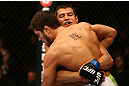 MONTREAL, QC - MARCH 16: (L-R) Patrick Cote and Bobby Voelker clinch in their welterweight bout during the UFC 158 event at Bell Centre on March 16, 2013 in Montreal, Quebec, Canada.  (Photo by Jonathan Ferrey/Zuffa LLC/Zuffa LLC via Getty Images)