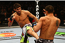 MONTREAL, QC - MARCH 16: (L-R) Patrick Cote lands a kick on Bobby Voelker in their welterweight bout during the UFC 158 event at Bell Centre on March 16, 2013 in Montreal, Quebec, Canada.  (Photo by Jonathan Ferrey/Zuffa LLC/Zuffa LLC via Getty Images)