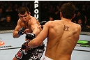 MONTREAL, QC - MARCH 16: (L-R) Bobby Voelker punches Patrick Cote in their welterweight bout during the UFC 158 event at Bell Centre on March 16, 2013 in Montreal, Quebec, Canada.  (Photo by Jonathan Ferrey/Zuffa LLC/Zuffa LLC via Getty Images)