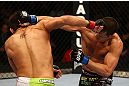 MONTREAL, QC - MARCH 16: (L-R) Patrick Cote and Bobby Voelker trade punches in their welterweight bout during the UFC 158 event at Bell Centre on March 16, 2013 in Montreal, Quebec, Canada.  (Photo by Jonathan Ferrey/Zuffa LLC/Zuffa LLC via Getty Images)