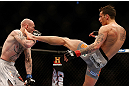 MONTREAL, QC - MARCH 16: Mike Ricci kicks Colin Fletcher in their lightweight bout during the UFC 158 event at Bell Centre on March 16, 2013 in Montreal, Quebec, Canada.  (Photo by Josh Hedges/Zuffa LLC/Zuffa LLC via Getty Images)