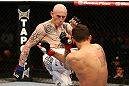 MONTREAL, QC - MARCH 16:  Colin Fletcher lands a kick against Mike Ricci in their lightweight bout during the UFC 158 event at Bell Centre on March 16, 2013 in Montreal, Quebec, Canada.  (Photo by Josh Hedges/Zuffa LLC/Zuffa LLC via Getty Images)