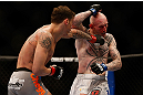 MONTREAL, QC - MARCH 16:  Mike Ricci lands a punch against Colin Fletcher in their lightweight bout during the UFC 158 event at Bell Centre on March 16, 2013 in Montreal, Quebec, Canada.  (Photo by Josh Hedges/Zuffa LLC/Zuffa LLC via Getty Images)