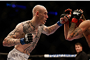 MONTREAL, QC - MARCH 16:  Colin Fletcher lands a punch against Mike Ricci in their lightweight bout during the UFC 158 event at Bell Centre on March 16, 2013 in Montreal, Quebec, Canada.  (Photo by Josh Hedges/Zuffa LLC/Zuffa LLC via Getty Images)