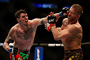 MONTREAL, QC - MARCH 16:  (L-R) Chris Camozzi punches Nick Ring in their middleweight bout during the UFC 158 event at Bell Centre on March 16, 2013 in Montreal, Quebec, Canada.  (Photo by Josh Hedges/Zuffa LLC/Zuffa LLC via Getty Images)