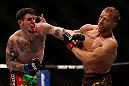 MONTREAL, QC - MARCH 16:  (L-R) Chris Camozzi punches Nick Ring in their middleweight bout during the UFC 158 event at Bell Centre on March 16, 2013 in Montreal, Quebec, Canada.  (Photo by Josh Hedges/Zuffa LLC/Zuffa LLC via Getty Images)