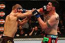 MONTREAL, QC - MARCH 16:  (L-R) Nick Ring punches Chris Camozzi in their middleweight bout during the UFC 158 event at Bell Centre on March 16, 2013 in Montreal, Quebec, Canada.  (Photo by Jonathan Ferrey/Zuffa LLC/Zuffa LLC via Getty Images)