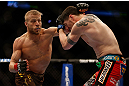 MONTREAL, QC - MARCH 16:  (L-R) Nick Ring punches Chris Camozzi in their middleweight bout during the UFC 158 event at Bell Centre on March 16, 2013 in Montreal, Quebec, Canada.  (Photo by Josh Hedges/Zuffa LLC/Zuffa LLC via Getty Images)