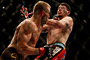 MONTREAL, QC - MARCH 16:  (L-R) Nick Ring punches Chris Camozzi in their middleweight bout during the UFC 158 event at Bell Centre on March 16, 2013 in Montreal, Quebec, Canada.  (Photo by Josh Hedges/Zuffa LLC/Zuffa LLC via Getty Images)