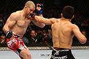 MONTREAL, QC - MARCH 16:  (R-L) Jake Ellenberger punches Nate Marquardt in their welterweight bout during the UFC 158 event at Bell Centre on March 16, 2013 in Montreal, Quebec, Canada.  (Photo by Jonathan Ferrey/Zuffa LLC/Zuffa LLC via Getty Images)