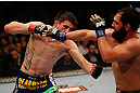 MONTREAL, QC - MARCH 16:  (L-R) Carlos Condit punches Johny Hendricks in their welterweight bout during the UFC 158 event at Bell Centre on March 16, 2013 in Montreal, Quebec, Canada.  (Photo by Josh Hedges/Zuffa LLC/Zuffa LLC via Getty Images)
