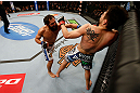 MONTREAL, QC - MARCH 16:  (L-R) Johny Hendricks punches Carlos Condit in their welterweight bout during the UFC 158 event at Bell Centre on March 16, 2013 in Montreal, Quebec, Canada.  (Photo by Josh Hedges/Zuffa LLC/Zuffa LLC via Getty Images)