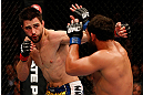 MONTREAL, QC - MARCH 16:  (L-R) Carlos Condit punches Johny Hendricks in their welterweight bout during the UFC 158 event at Bell Centre on March 16, 2013 in Montreal, Quebec, Canada.  (Photo by Josh Hedges/Zuffa LLC/Zuffa LLC via Getty Images)