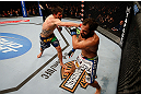 MONTREAL, QC - MARCH 16:  (L-R) Carlos Condit punches Johny Hendricks in their welterweight bout during the UFC 158 event at Bell Centre on March 16, 2013 in Montreal, Quebec, Canada.  (Photo by Josh Hedges/Zuffa LLC/Zuffa LLC via Getty Images)