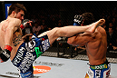 MONTREAL, QC - MARCH 16:  (L-R) Carlos Condit kicks Johny Hendricks in their welterweight bout during the UFC 158 event at Bell Centre on March 16, 2013 in Montreal, Quebec, Canada.  (Photo by Josh Hedges/Zuffa LLC/Zuffa LLC via Getty Images)