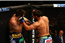 MONTREAL, QC - MARCH 16:  (R-L) Johny Hendricks punches Carlos Condit in their welterweight bout during the UFC 158 event at Bell Centre on March 16, 2013 in Montreal, Quebec, Canada.  (Photo by Jonathan Ferrey/Zuffa LLC/Zuffa LLC via Getty Images)