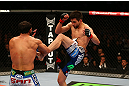 MONTREAL, QC - MARCH 16:  (R-L) Carlos Condit kicks Johny Hendricks in their welterweight bout during the UFC 158 event at Bell Centre on March 16, 2013 in Montreal, Quebec, Canada.  (Photo by Jonathan Ferrey/Zuffa LLC/Zuffa LLC via Getty Images)