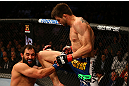 MONTREAL, QC - MARCH 16:  (R-L) Carlos Condit knees Johny Hendricks in their welterweight bout during the UFC 158 event at Bell Centre on March 16, 2013 in Montreal, Quebec, Canada.  (Photo by Jonathan Ferrey/Zuffa LLC/Zuffa LLC via Getty Images)