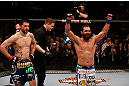 MONTREAL, QC - MARCH 16:  (R-L) Johny Hendricks and Carlos Condit react after the conclusion of their welterweight bout during the UFC 158 event at Bell Centre on March 16, 2013 in Montreal, Quebec, Canada.  (Photo by Josh Hedges/Zuffa LLC/Zuffa LLC via Getty Images)